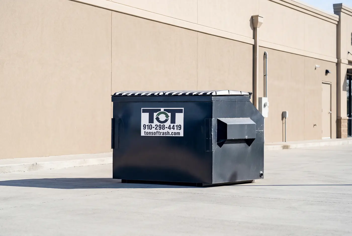 4-yard Tons of Trash front-load commercial dumpster